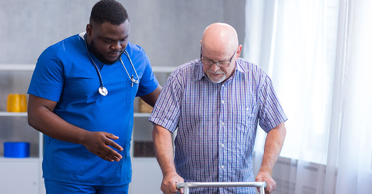 A family nurse practitioner treats an older patient.