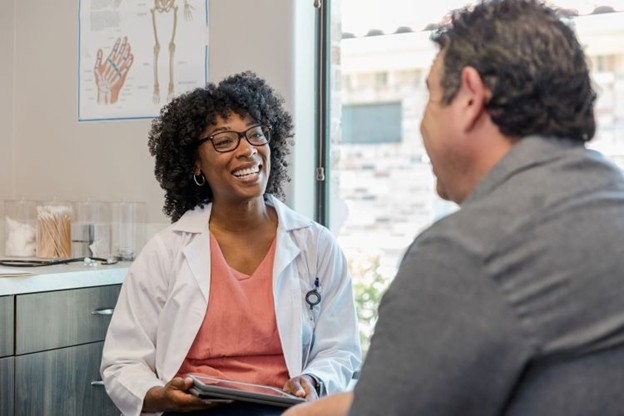 A Mental Health nurse practitioner is talking with a patient 