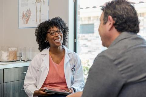 A Mental Health nurse practitioner is talking with a patient 